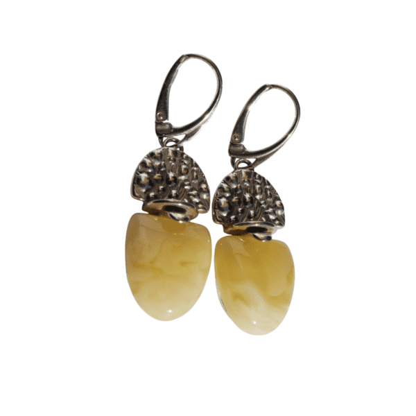 a pair of earrings with a white and yellow stone