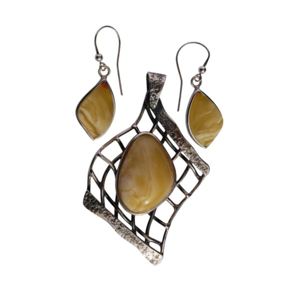 The AMBER EMBRACE set features a pendant and earrings with light brown, oval-shaped amber stones in textured silver frames.