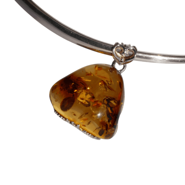 a amber pendant on a silver necklace