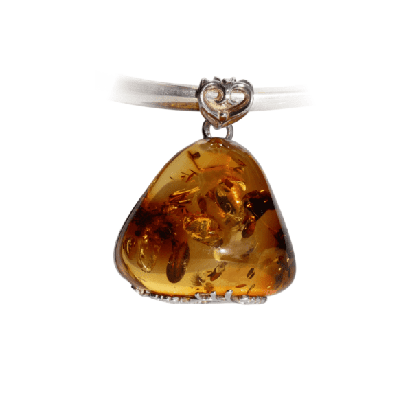 a amber pendant with a silver heart