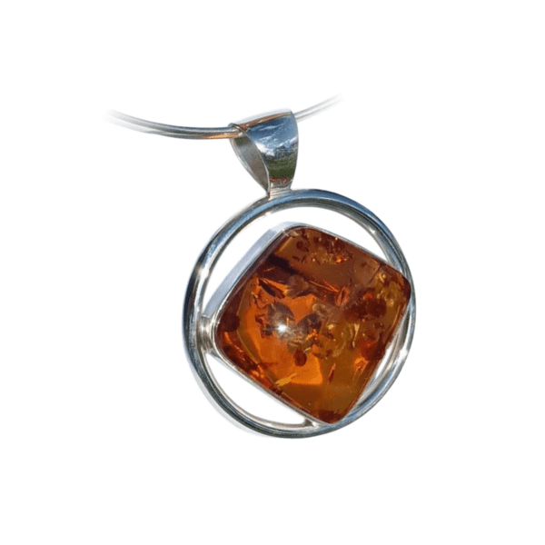 a amber pendant on a white background