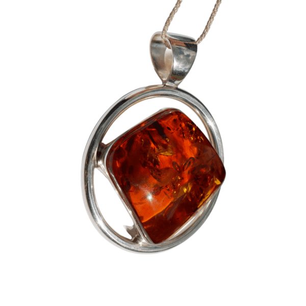 a amber pendant on a white background