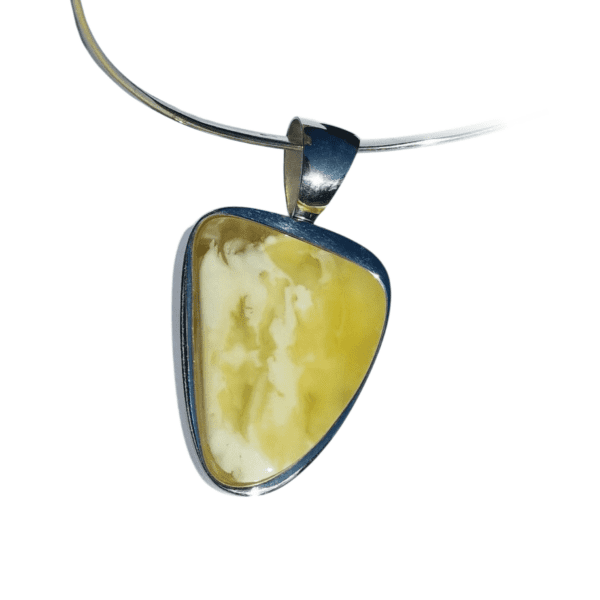 a necklace with a yellow stone pendant