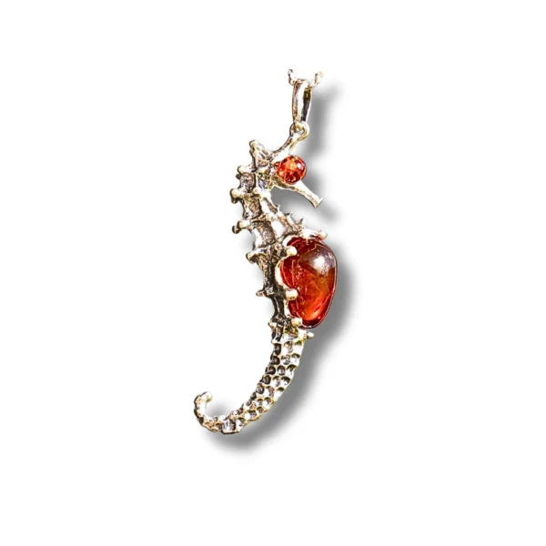 Side view of amber seahorse pendant showing silver detailing