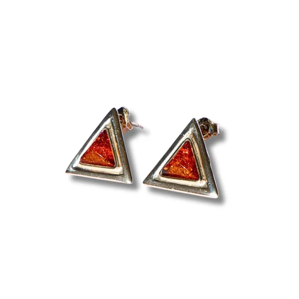 Close-up of triangular Baltic amber earrings set in polished sterling silver, designed for everyday elegance