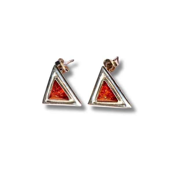 Side angle of triangular amber earrings with a secure butterfly back, highlighting their unique geometric design